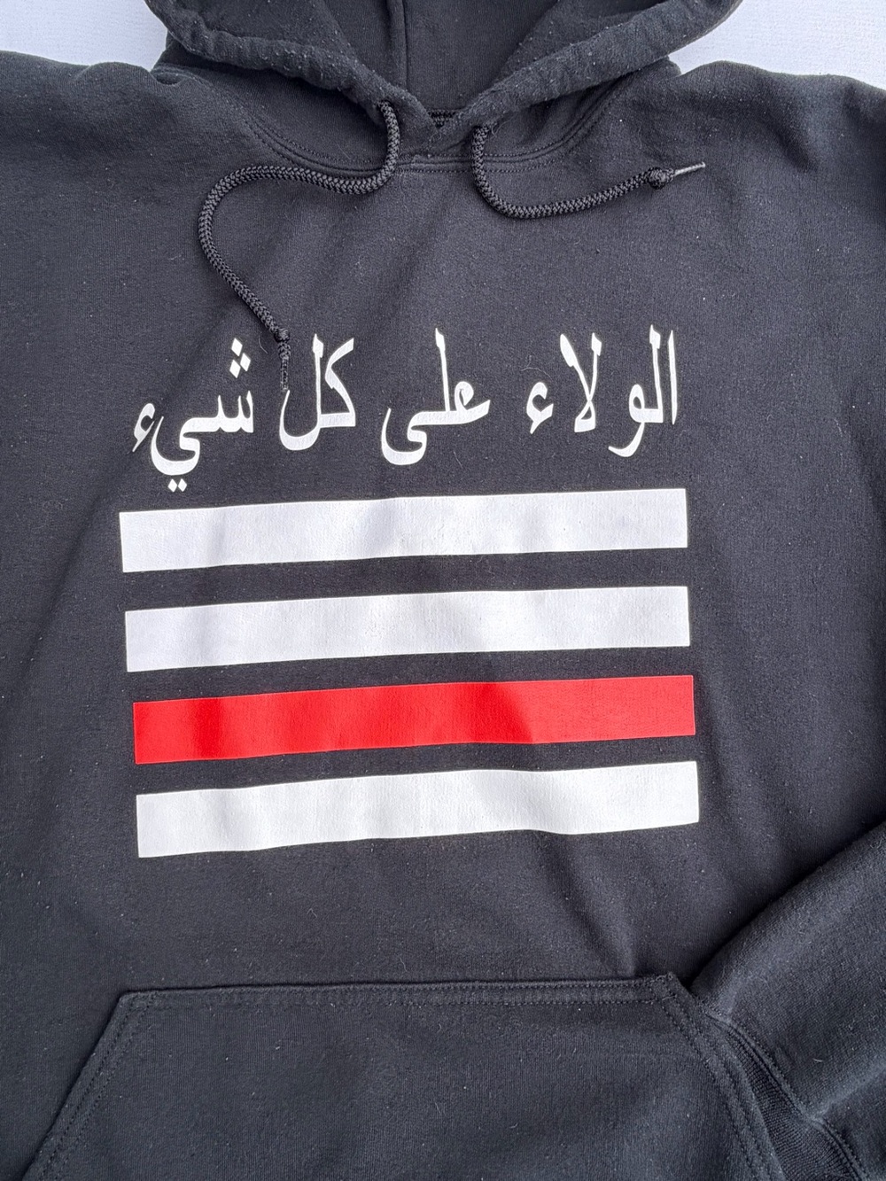 Arabic Script الولاء على كل شيء “Loyalty Above Everything” Hoodie Red Stripe
